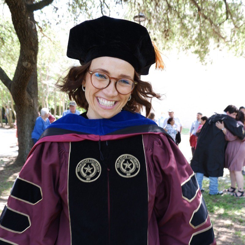 Dr. Danielle Bryant, in doctoral regalia on graduation day