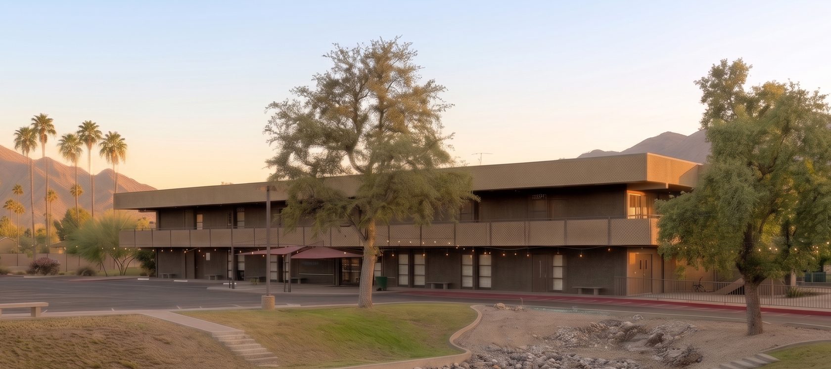 The Civic School campus building at 2131 E Lincoln Drive, Phoenix, at dusk with the mountains behind
